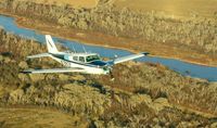 N7882P - Piper Comanche 250 flying over the Rio Grande just south of Albuquerque.