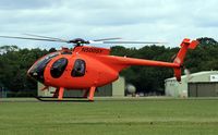 N500SY @ EGLD - This MDH 369E was previously registered, N5144Q which was used by, Simon Oliphant-Hope of Eastern Atlantic Helicopters to circumnavigate the globe in 2004. A new world record at 17 days, 14 hours, 2 minutes and 27 seconds as N5144Q. There's a video interv