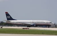 N453UW @ KPBI - Boeing 737-400 - by Mark Pasqualino