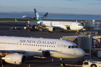 ZK-NCG @ NZAA - ZK-OJA in the foreground - by Micha Lueck