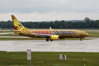 D-ATUD @ EDDM - Gold Bear in the rain - by Loetsch Andreas