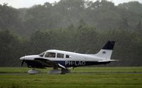 PH-LAG @ EGLD - Photo taken wile it was raining.
