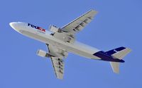N716FD @ KLAX - Departing LAX on 25L - by Todd Royer
