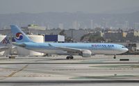 HL8211 @ KLAX - Taxiing to gate at LAX - by Todd Royer