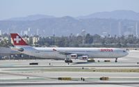 HB-JMA @ KLAX - Taxiing to gate at LAX - by Todd Royer