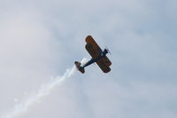 N56878 - Pulling out of a formation of GA planes, this PT-17 (41-8153) is performing the  - by Glenn E. Chatfield