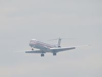 N967TW @ ONT - Coming out of the overcast sky for runway 26R - by Helicopterfriend