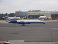 N12563 @ EWR - erj-145lr - by christian maurer