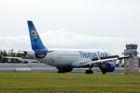 OY-VKM @ ENRY - Thomas Cook Airlines A320 taxying towards the tower of Rygge airport, Norway.