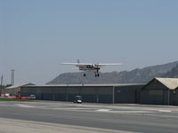 N704JH @ SZP - 1976 Cessna 150M, Continental O-200 100 Hp, another on final Rwy 22 - by Doug Robertson