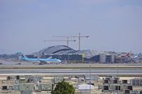 HL8211 @ KLAX - Korean Air taxiing with the new Tom Bradley terminal in the background