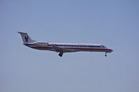 N848AE @ KLAX - Embraer 135 landing on final to Rwy 24R - by speedbrds