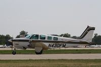 N430FM @ KOSH - Beech A36 - by Mark Pasqualino