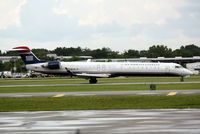N928LR @ KSRQ - US Air Flight 2607 operated by Mesa (N928LR) arrives at Sarasota-Bradenton International Airport following a flight from Charlotte-Douglas International Airport - by Jim Donten