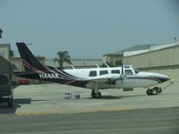 N44AK @ CNO - Working on her outside a hanger - by Helicopterfriend