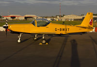 G-BWXT @ EGSH - Sat on stand at SaxonAir in the setting sun.