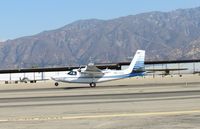 N67SS @ CCB - Main gear down, nose wheel coming down on runway 24 - by Helicopterfriend