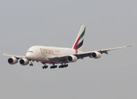 A6-EDL @ AMS - Landing on runway C18 of Schiphol Airport - by Willem Göebel