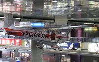 N9172B @ KLAS - Hacienda Hotel Cessna 172 Skyhawk hanging over the baggage claim at KLAS. - by Kreg Anderson