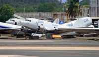 N138FS @ SJU - Alas, Four Star Cargo is no more; this poor DC-3  is acquiring a coat of mold.  At least she is much better shape than the unfortunate birds in the background. - by Daniel L. Berek