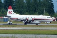 C-FYYJ @ CYXX - Conair 1961 Lockheed 188A, c/n: 1143 - by Terry Fletcher