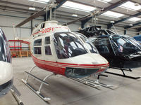 G-DOFY @ EGBS - inside the Tiger Helicopter's Hangar at Shobdon Airfield, Herefordshire - by Chris Hall