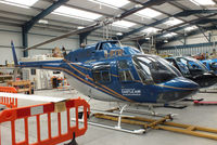 G-BYBI @ EGBS - inside the Tiger Helicopter's Hangar at Shobdon Airfield, Herefordshire - by Chris Hall