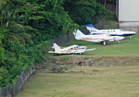N38967 @ TLPC - Bereft of its engines, this poor Piper has been sitting at this airport for quite a while.  Its owner, Bird of Paradise appears to have gone out of business.  It is seen, accompanied by two aircraft of General Aviation Services that have suffered struct - by Daniel L. Berek