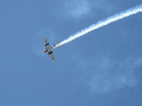 N1038A @ CMA - 1944 North American SNJ-5 WAR DOG, P&W R-1340 Wasp 600 Hp, low level aerobatics with smoke - by Doug Robertson