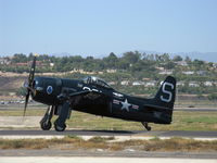 N7825C @ CMA - 1949 Grumman F8F-2 BEARCAT, P&W R-2800-34W 2,100 Hp. This aircraft is a 1949, not 1948 as registered. Taxi to 26 - by Doug Robertson
