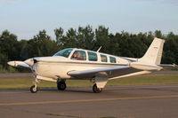 N21ET @ 4B8 - The N21ET pilot waves to me as he taxis to his parking. - by Mark K.