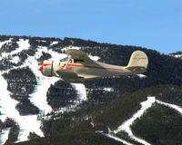 N79091 - N79091 over mountain range - by MCIA