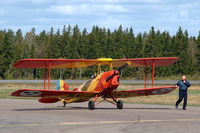SE-CWG @ ESMX - Tiger Moth SE-CWG is taxied in by its owner Per Cederqvist while Filip Gerhardt (Mustang pilot) is tiprunning. - by Henk van Capelle