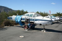 N8562H @ SZP - Parked along the river. Now with tarp - by N.A. Taylor