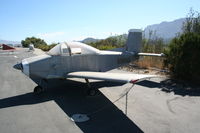 N6300V @ SZP - Parked along the river - by N.A. Taylor
