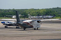 N151CA @ TJSJ - A new turboprop sits alongside two of its much older piston-engine Beech 18s. - by Daniel L. Berek