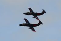 G-DELF @ EGFH - Red Star Rebels second three ship practice session. G-DELF (Rebel 1) leading G-BYCT (Rebel 2) in a topside pass over Swansea Airport. G-DLFN out of shot. - by Roger Winser