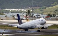 N407UA @ TNCM - N407UA