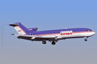 N203FE @ KPHX - Jan. 1997 - early morning arrival at PHX - by John Meneely