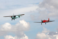 G-AEVS @ EGBR - Aeronca 100 leads Dart Kitten II at The Real Aeroplane Club's Summer Madness Fly-In, Breighton Airfield, August 2012. - by Malcolm Clarke