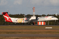 VH-QOI @ YBBN - QantasLink DHC-8 - by Thomas Ranner