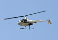 N3183T - A tour helicopter takes journalists or curiosity seekers over El Morro Castle in Old San Juan, where a peace demonstration was under way. - by Daniel L. Berek