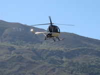 N8828F @ SZP - 1963 Hughes 269A, Lycoming O&VO-360 180 Hp, approach from Santa Clara River route to SZP's helipad, Santa Paula, Limited class. Ten mile long 2,263' South Mountain in background - by Doug Robertson