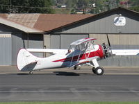 N32135 @ SZP - 1941 Waco UPF-7, Continental W670 220 Hp radial, chromed engine, prop & spinner, a stunning showplane, S-turns taxi from hangar to Rwy 22 - by Doug Robertson