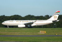 A6-EYD @ EGCC - Etihad Airways - by Chris Hall
