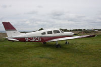 G-JACH @ EGJA - parked on the grass at the edge of the airfield - by alanh