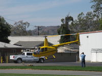 N7523T @ SZP - 2004 Robinson R44 RAVEN II, Lycoming O-540 derated to 245 Hp for 5 minutes, 205 Hp continuous, refinished-color me sold, liftoff with a photo farewell - by Doug Robertson