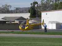 N7523T @ SZP - 2004 Robinson R44 RAVEN II, Lycoming O-540 derated to 245 Hp for 5 minutes, 205 Hp continuous, refinished-color me sold, engine ground warmup for departure which means goodbye - by Doug Robertson