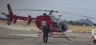 N519MT @ KTUS - James Campbell during his preflight inspection of N519MT at MedTrans hangar KTUS, Tucson AZ - by Ehud Gavron