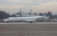 N722EV @ CLT - ASA CRJ-700 taken out the not so good window of N744P - by Florida Metal